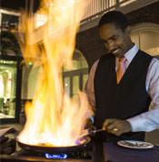 Banana's Foster Being prepared in the courtyard at Brennan's